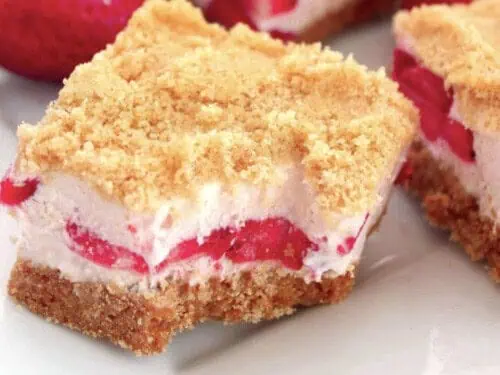 strawberry shortcake bars with bite missing.